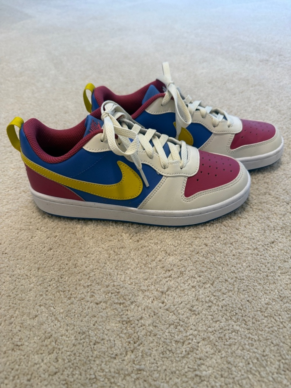 Nike Kids Low-Top Sneakers in White, Blue, Pink & Yellow